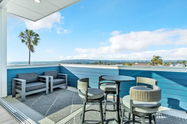 a terrace of a house with outdoor seating