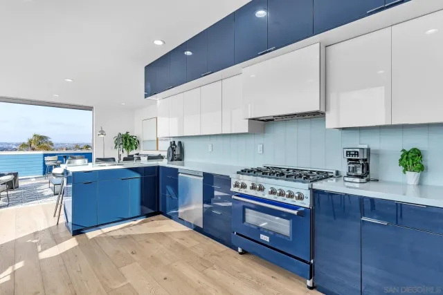 a kitchen with stainless steel appliances granite countertop a stove a sink dishwasher and a refrigerator