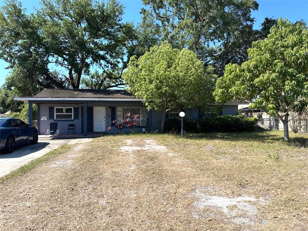 a view of a house with a yard and garage