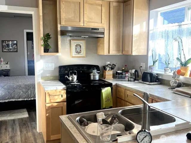a kitchen with a sink and cabinets