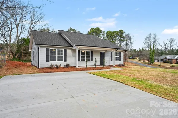 a house with trees in the background