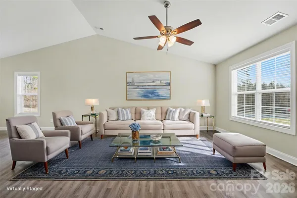 a living room with furniture or couch and a large window