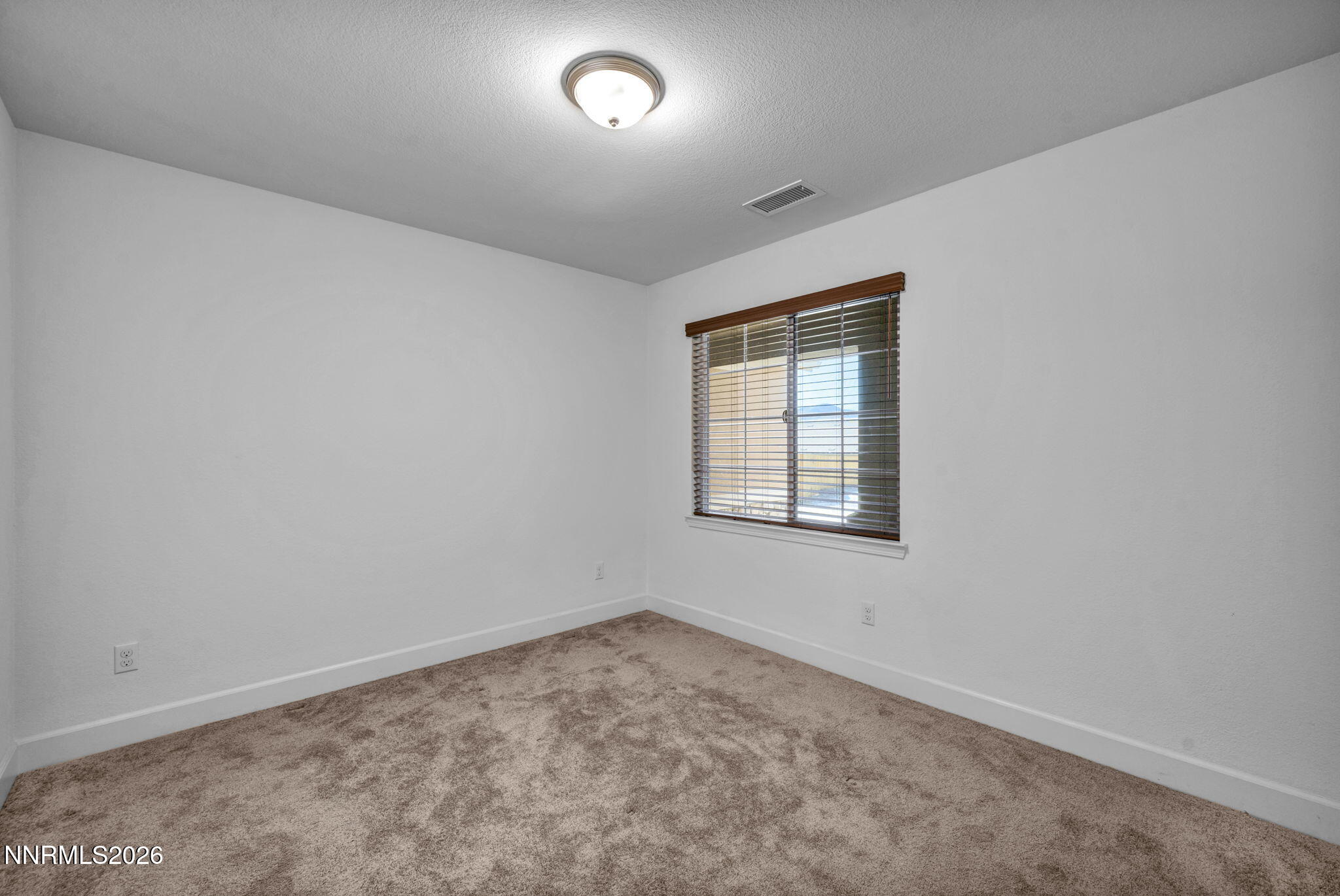 7181 Saddlehorn Road Carson City, NV 89701 - Photo 33 of 62 an empty room with a window