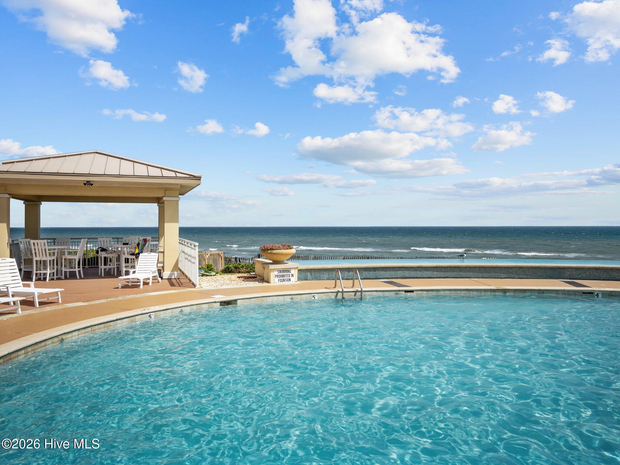 1435 Salter Path Road, Unit K3 Indian Beach, NC 28512 - Photo 19 of 22 Pool View with Covered Seating Area
