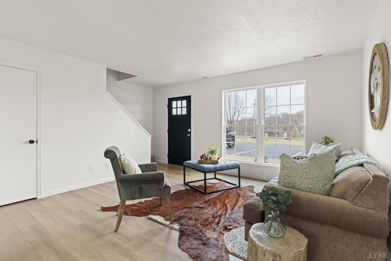 178 Dulwich Drive, Unit 200 Amherst, VA 24521 - Photo 4 of 22 a living room with furniture and a large window