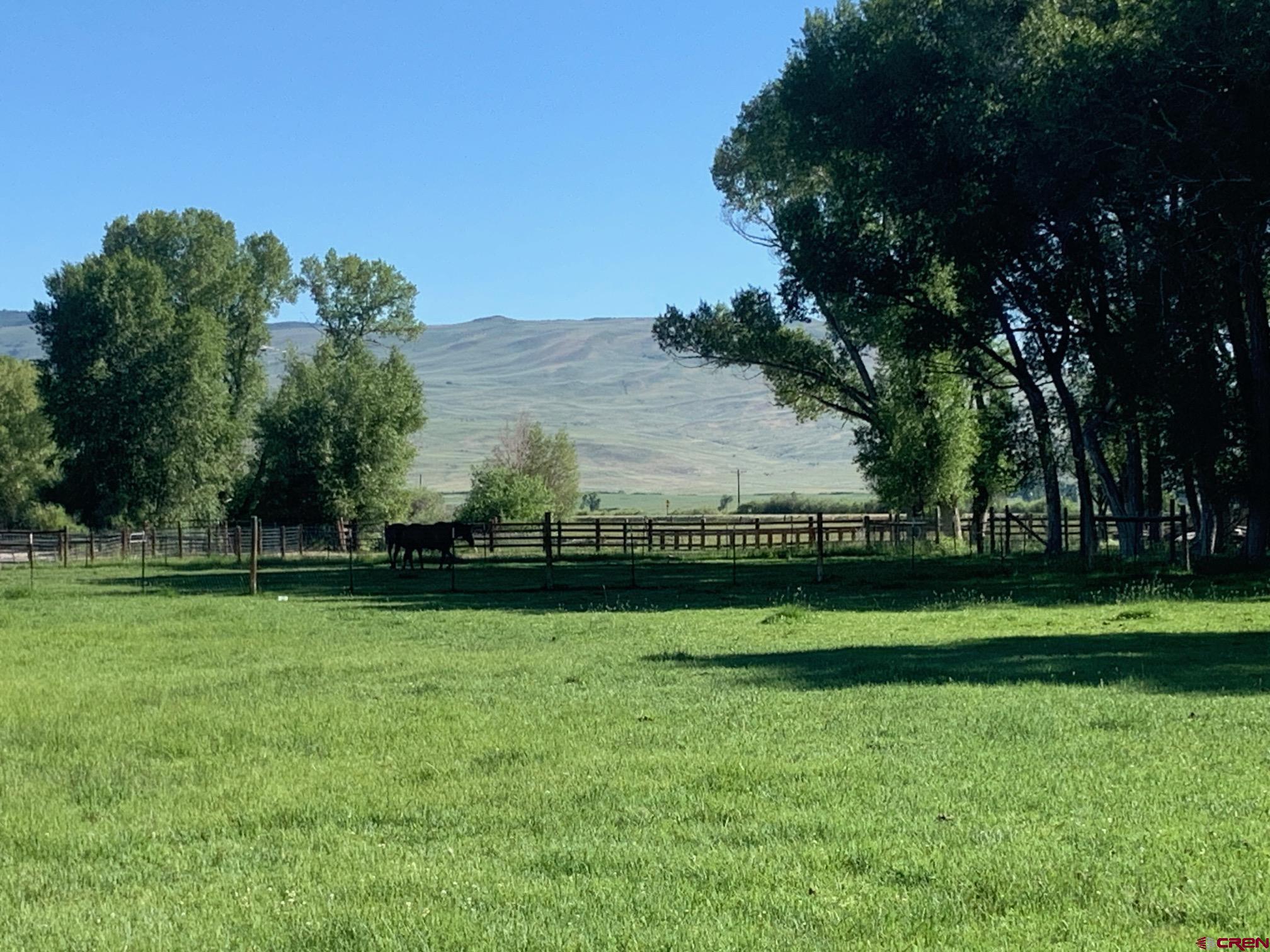607 County Road 730 Gunnison, CO 81230 - Photo 14 of 35 a view of a golf course with a lake