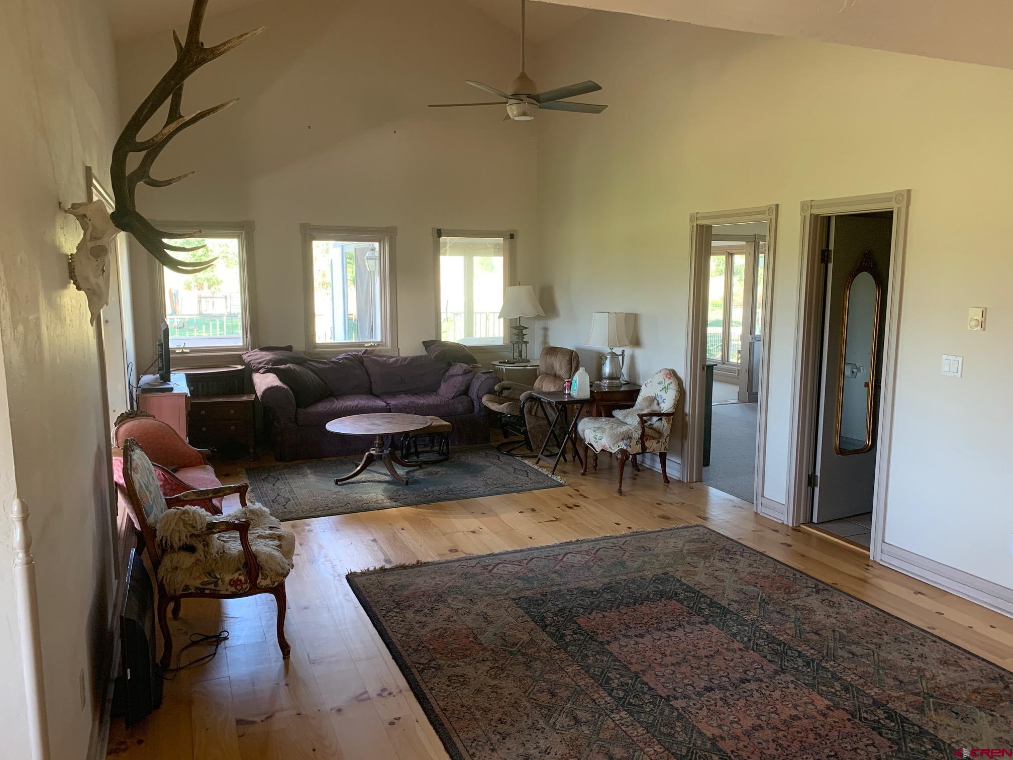 607 County Road 730 Gunnison, CO 81230 - Photo 22 of 35 a living room with furniture rug and a window