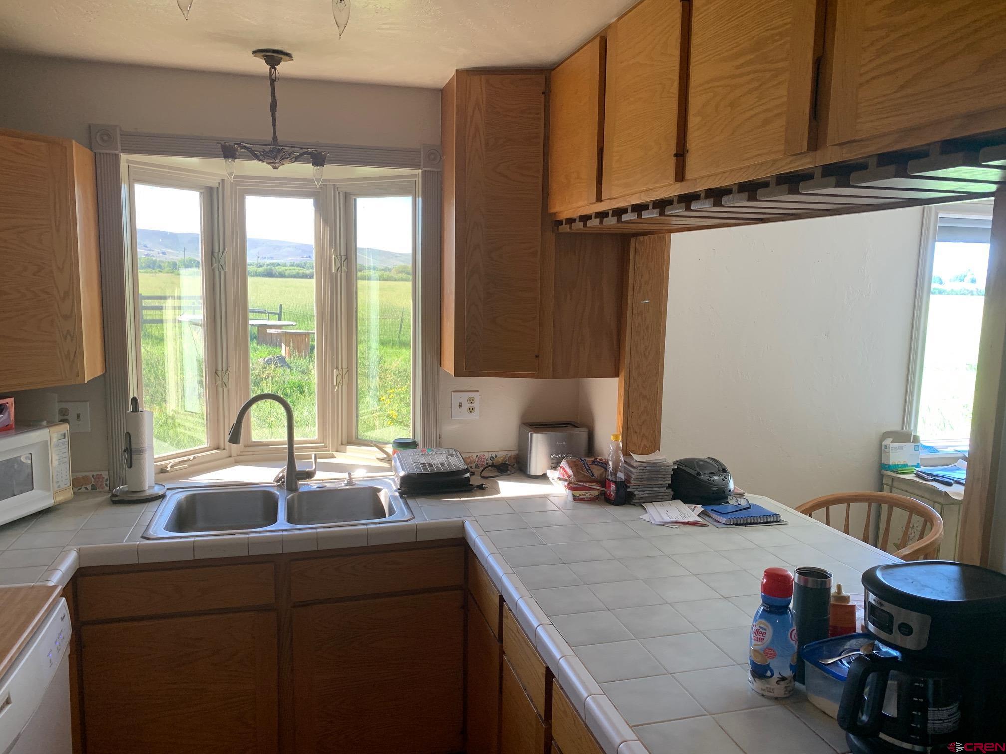 607 County Road 730 Gunnison, CO 81230 - Photo 23 of 35 a kitchen with a sink and a window