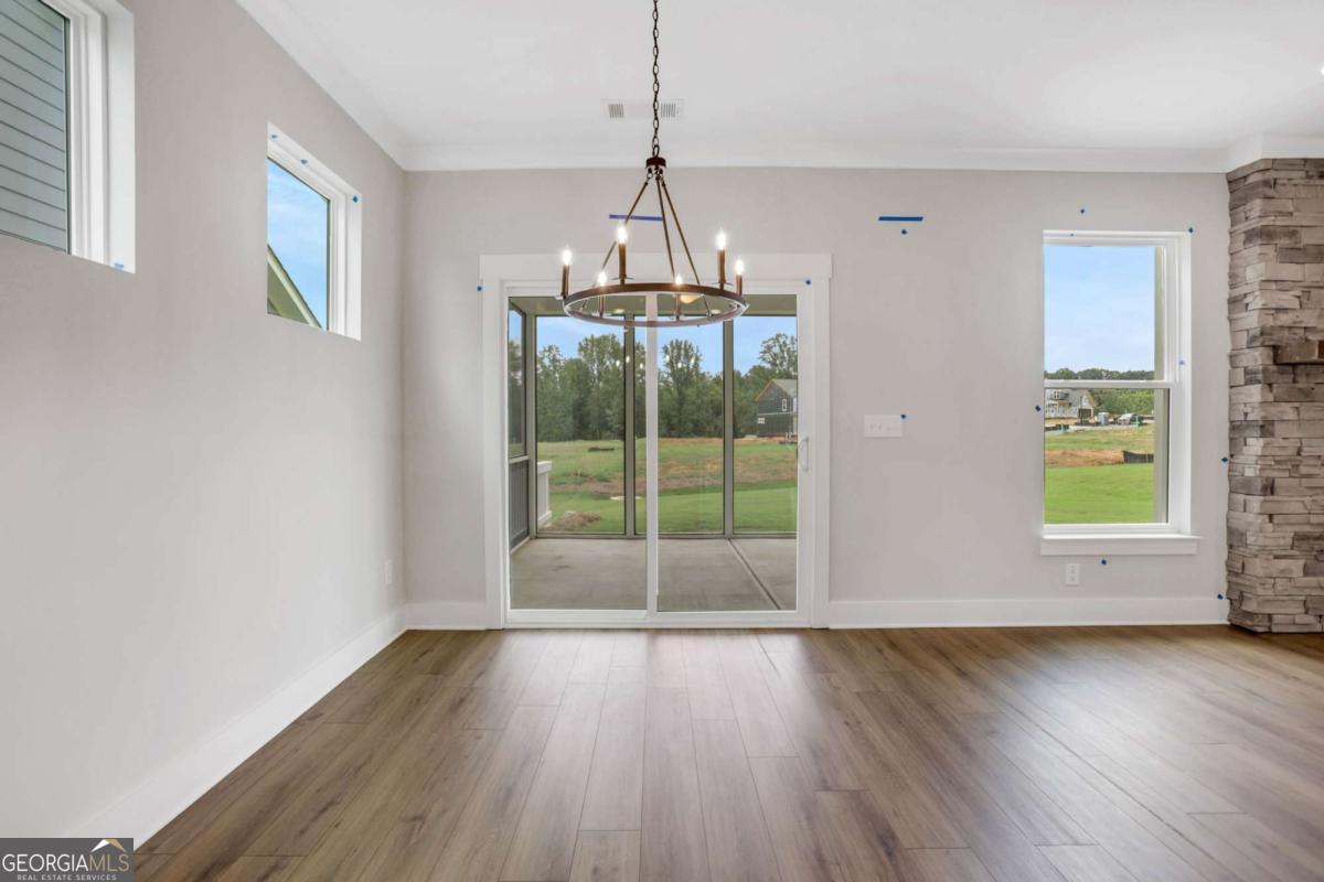 4250 Mary Ruth Way Loganville, GA 30052 - Photo 18 of 50 a view of wooden floor and windows in a room
