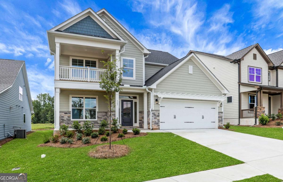 4250 Mary Ruth Way Loganville, GA 30052 - Photo 2 of 50 a front view of a house with garden