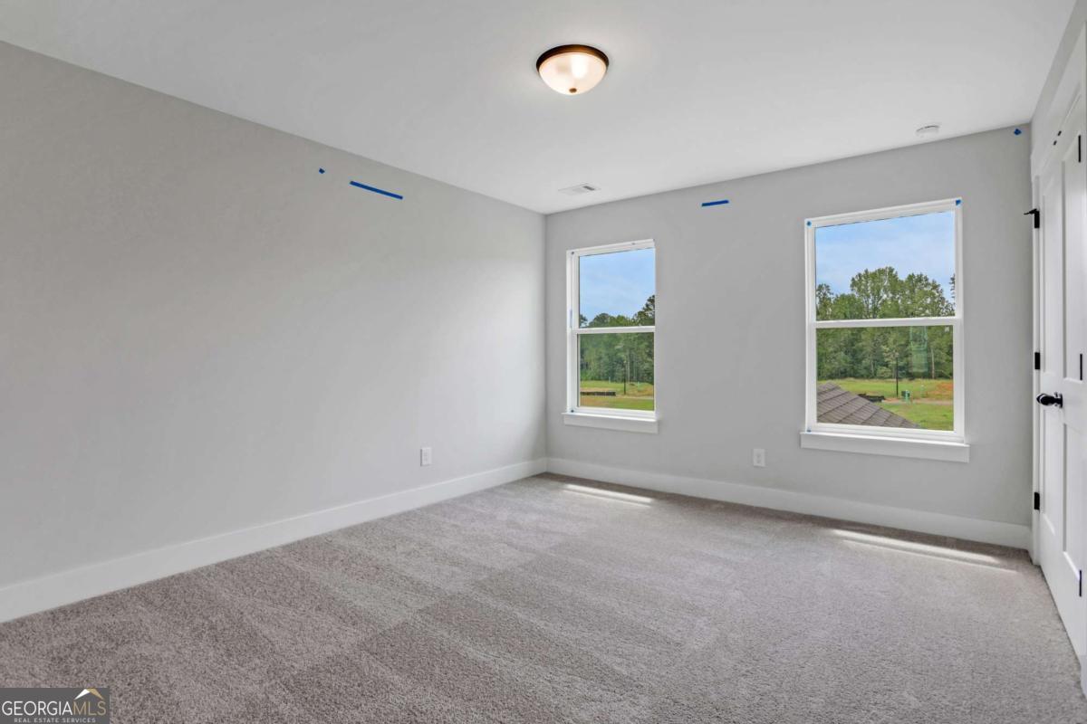 4250 Mary Ruth Way Loganville, GA 30052 - Photo 27 of 50 an empty room with windows and closet
