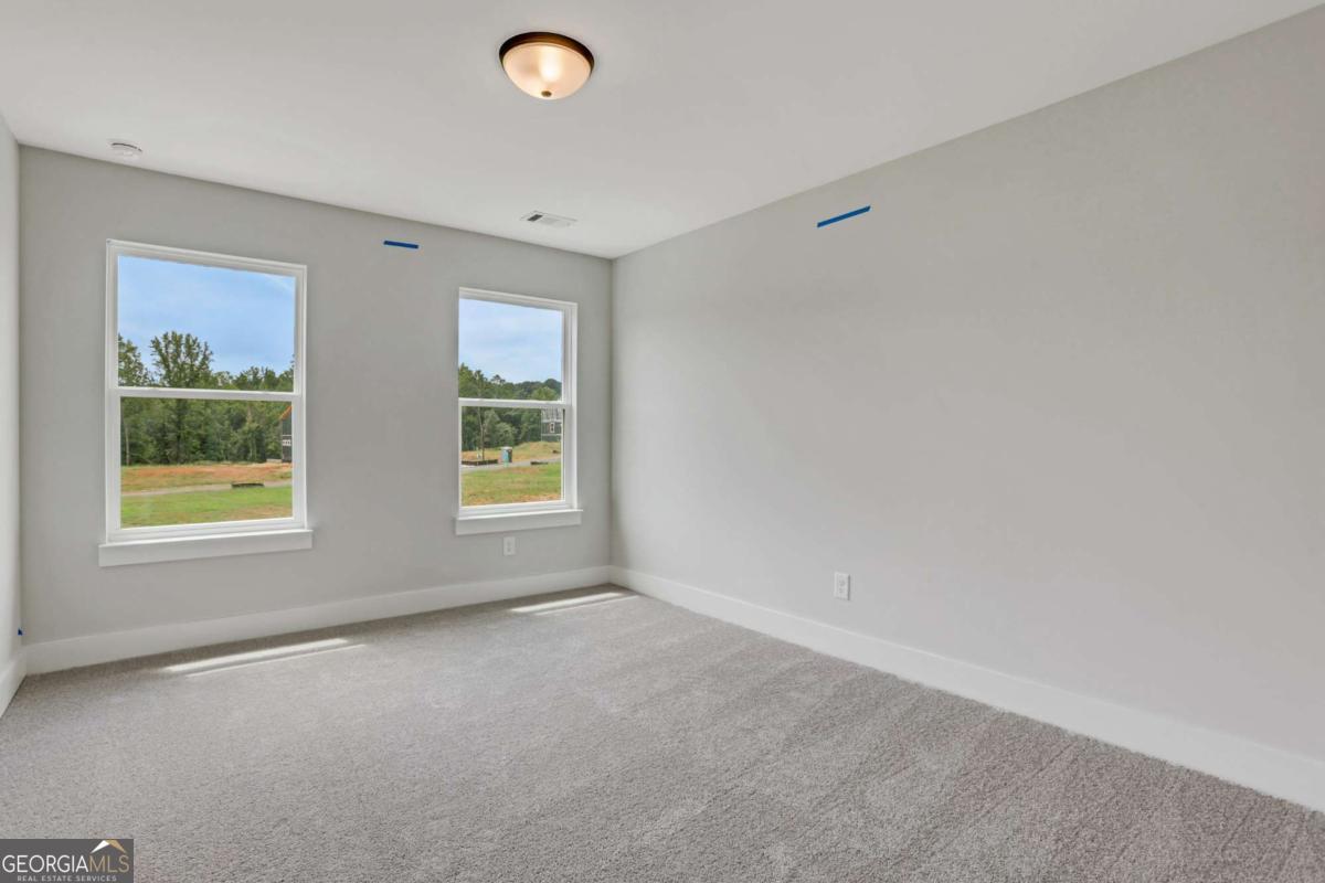 4250 Mary Ruth Way Loganville, GA 30052 - Photo 29 of 50 a view of an empty room with a window