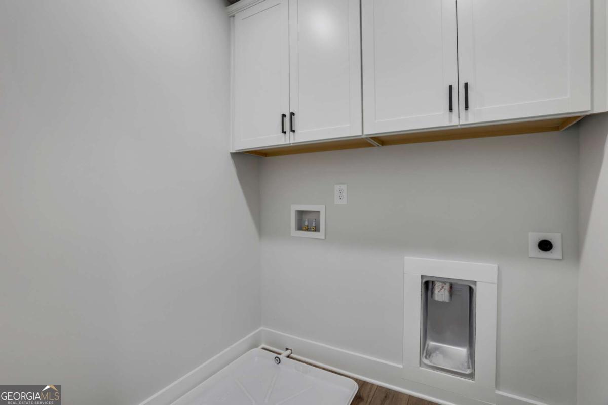 4250 Mary Ruth Way Loganville, GA 30052 - Photo 32 of 50 a view of storage and utility room with window