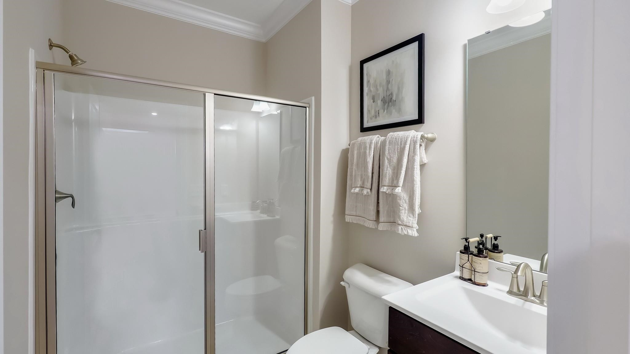 524 Tanner Lk Lane Raleigh, NC 27610 - Photo 26 of 35 a bathroom with a sink a toilet and shower