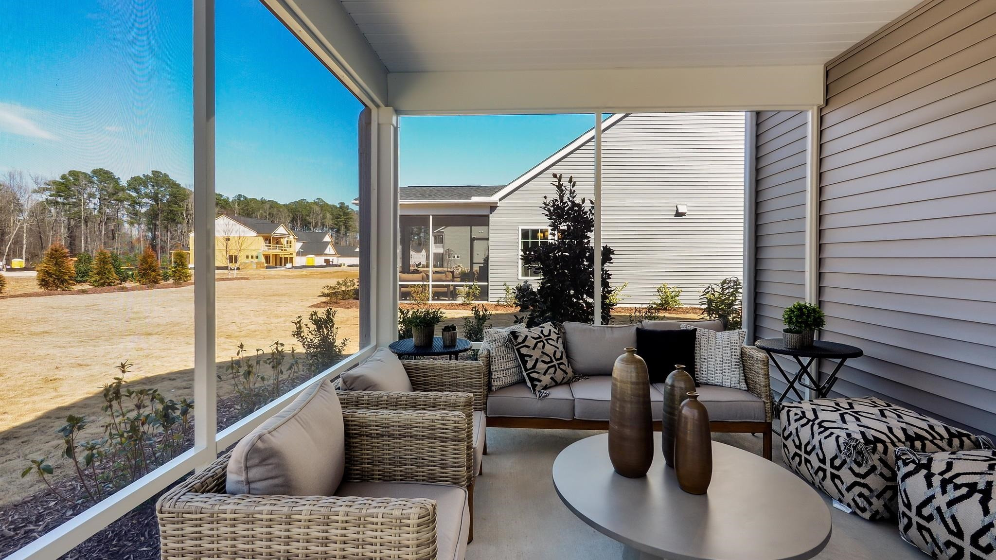 524 Tanner Lk Lane Raleigh, NC 27610 - Photo 34 of 35 a living room with patio furniture and a potted plant