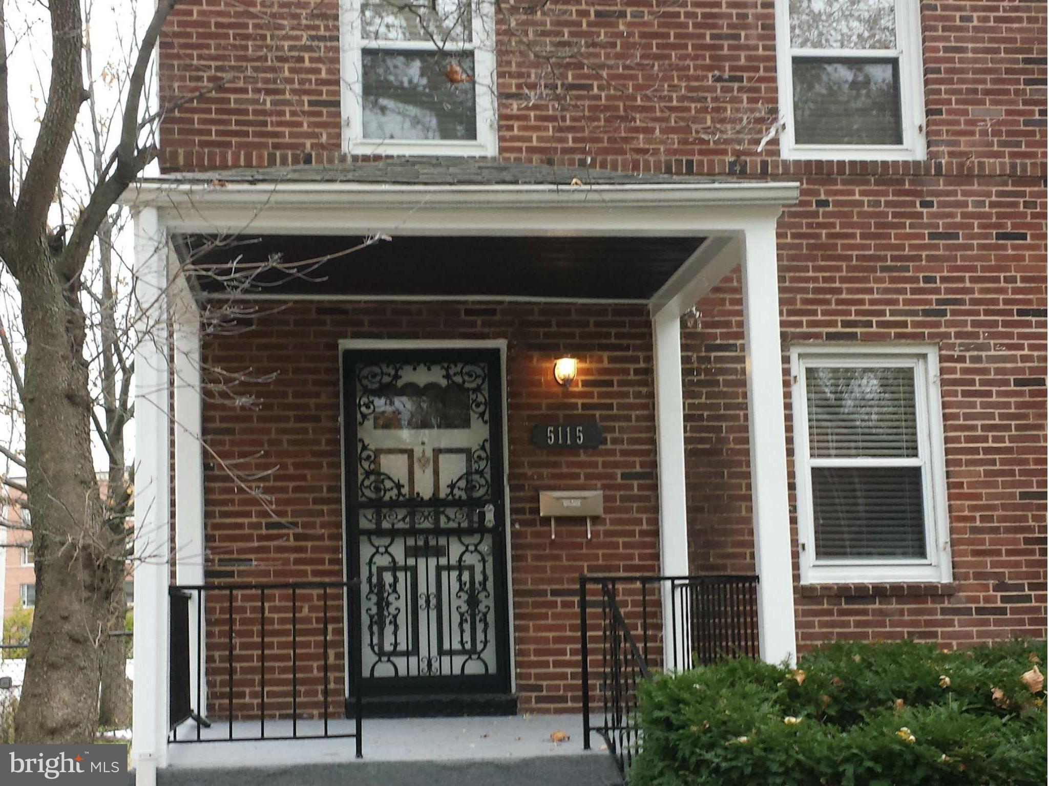 5115 Sunset Road Baltimore, MD 21215 - Photo 1 of 24 a front view of a house with glass windows