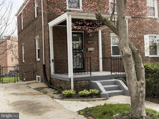 5115 Sunset Road Baltimore, MD 21215 - Photo 2 of 24 a front view of a house with garden