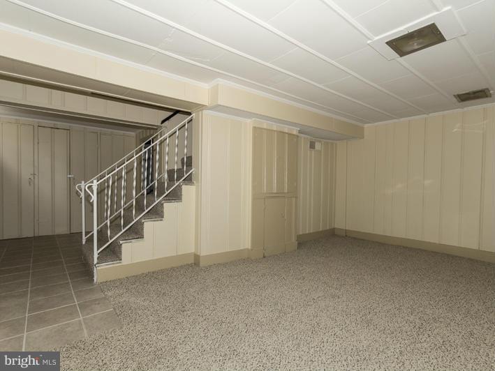 5115 Sunset Road Baltimore, MD 21215 - Photo 18 of 24 a view of an empty room with stairs