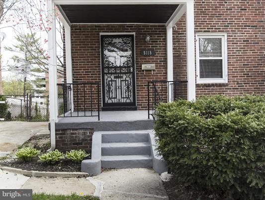 5115 Sunset Road Baltimore, MD 21215 - Photo 3 of 24 a front view of a house with plants