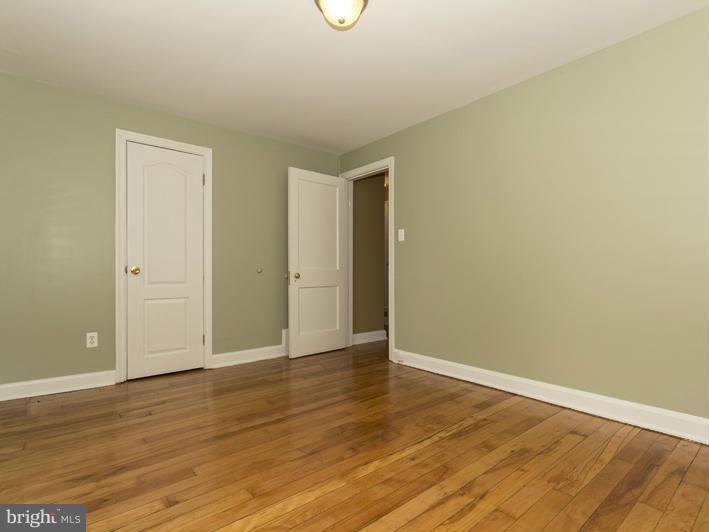 5115 Sunset Road Baltimore, MD 21215 - Photo 22 of 24 a view of an empty room with wooden floor