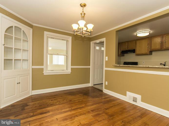 5115 Sunset Road Baltimore, MD 21215 - Photo 8 of 24 a view of an empty room with a window