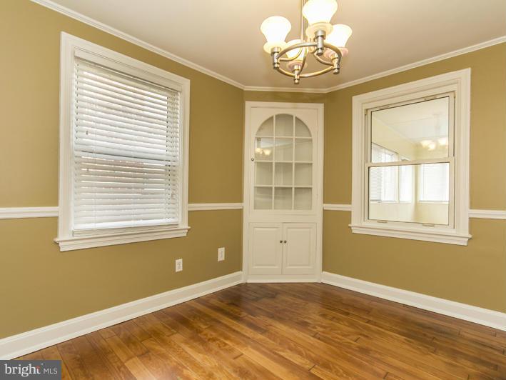 5115 Sunset Road Baltimore, MD 21215 - Photo 9 of 24 a view of an empty room with a window