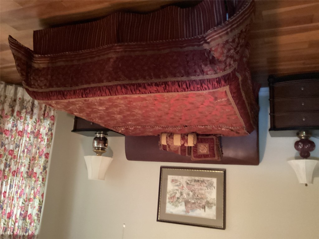 128 Crystal Springs Drive Georgetown, TX 78633 - Photo 2 of 7 a bedroom with a bed and a lamp on dresser