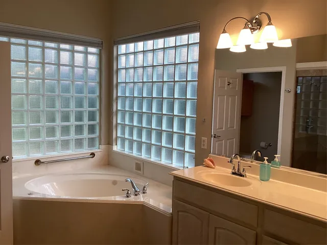 a bathroom with a sink and a bathtub