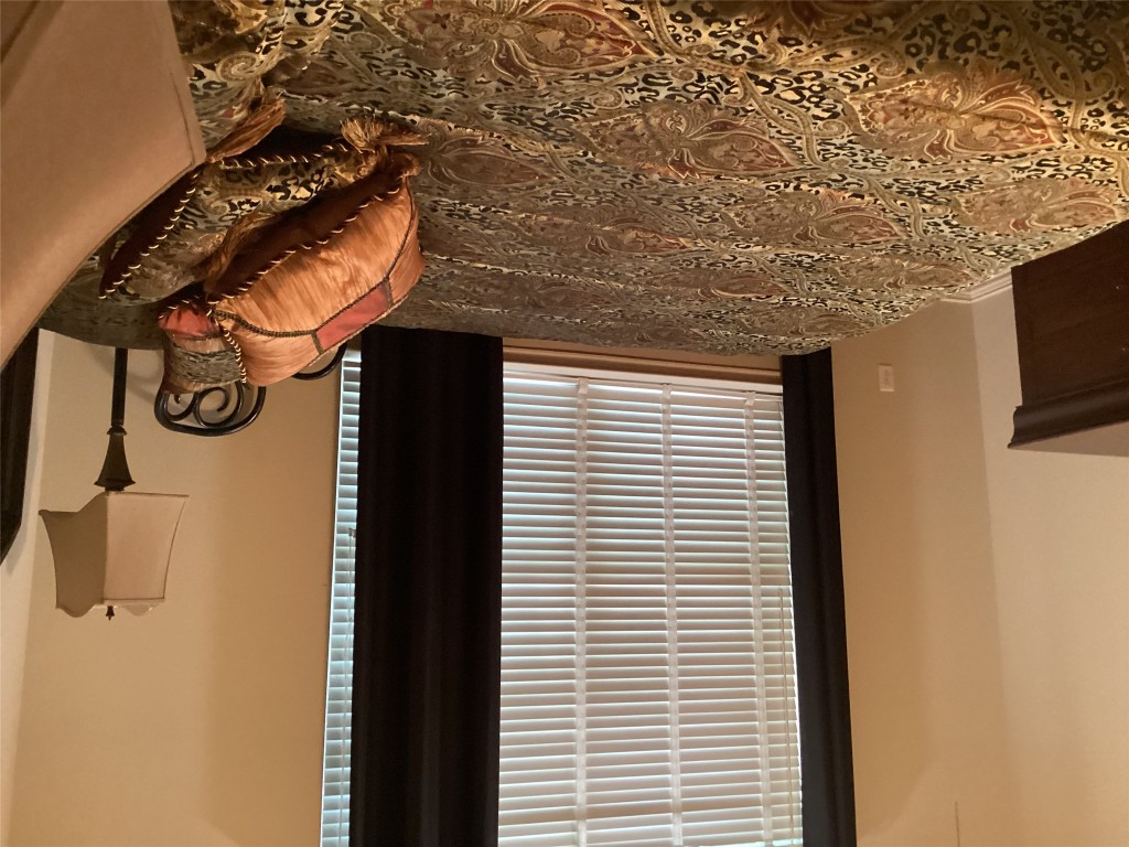 128 Crystal Springs Drive Georgetown, TX 78633 - Photo 4 of 7 a bedroom with a bed and a window