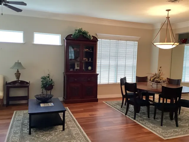 a view of a dining room with furniture and window