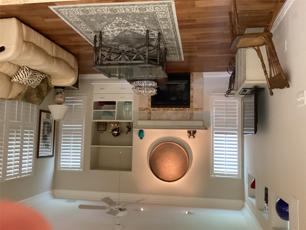 128 Crystal Springs Drive Georgetown, TX 78633 - Photo 6 of 7 a living room with furniture a window and a fireplace