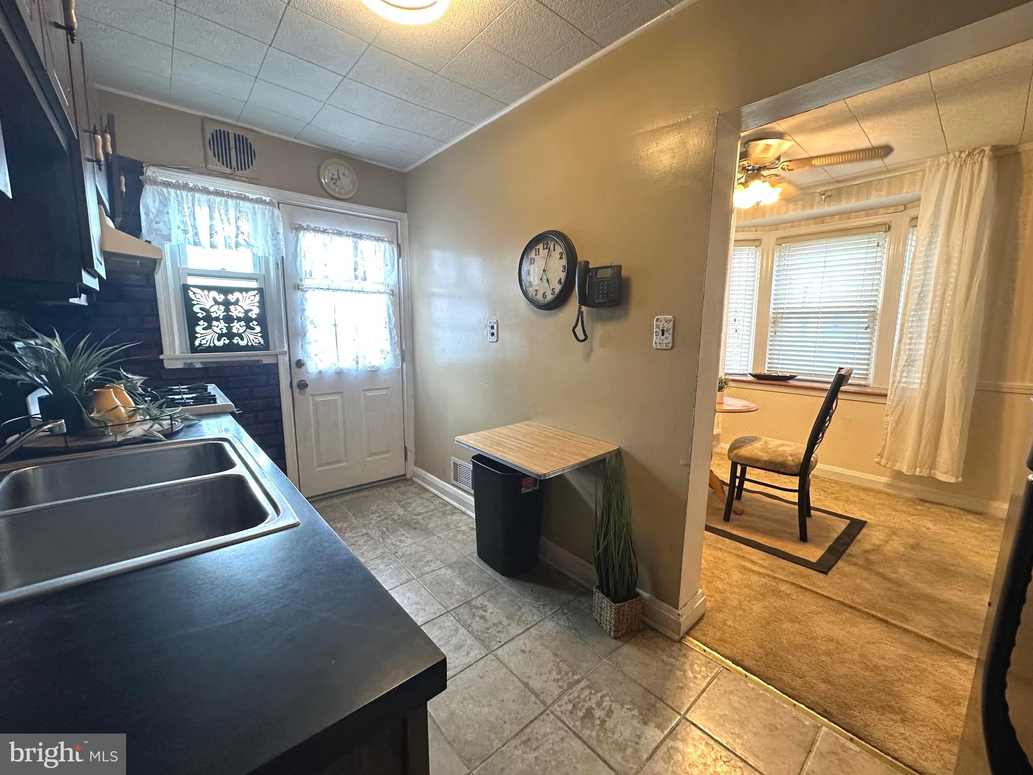8454 Kavanagh Road Baltimore, MD 21222 - Photo 14 of 23 a living room with furniture and a table