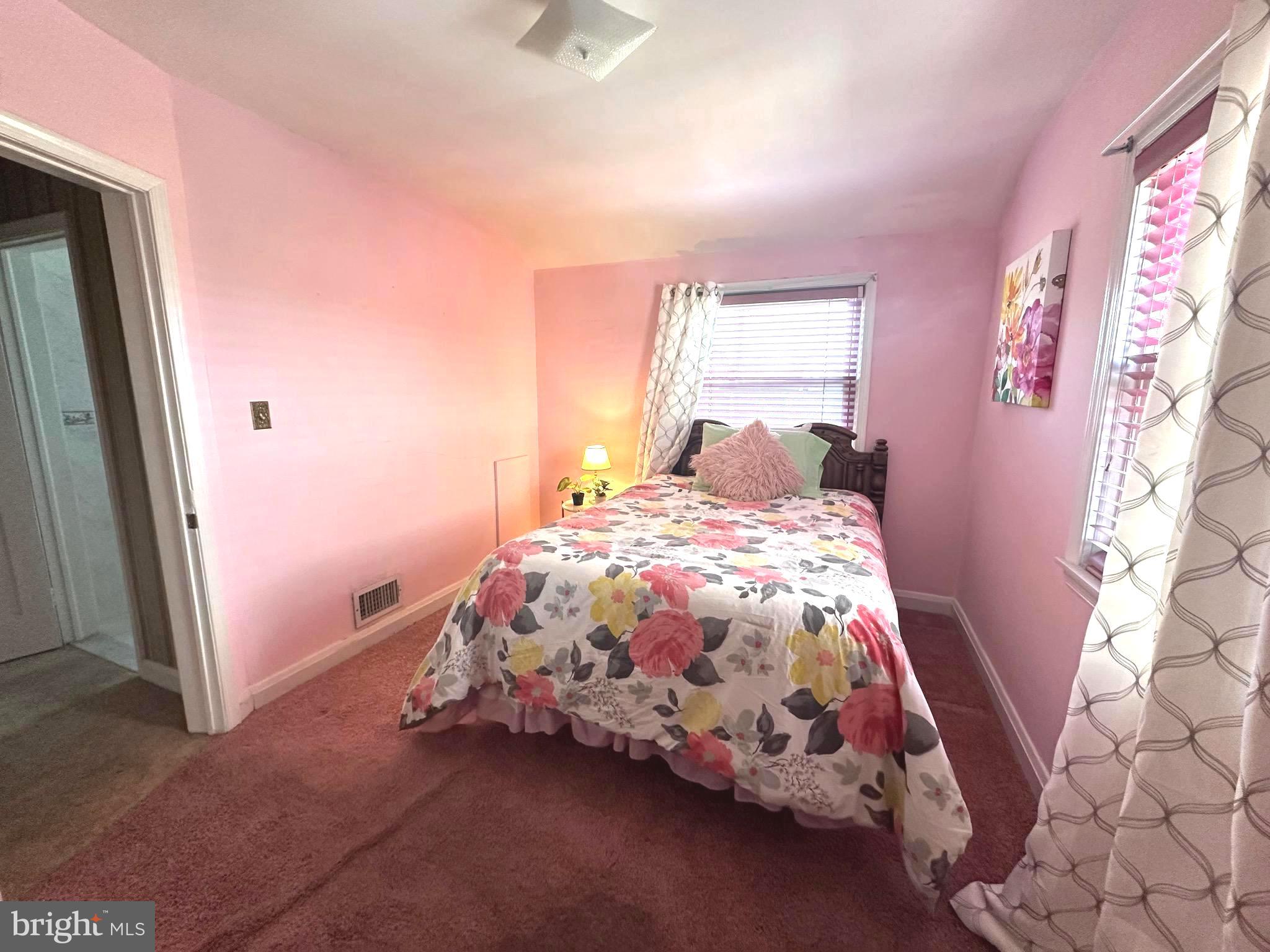 8454 Kavanagh Road Baltimore, MD 21222 - Photo 16 of 23 a bedroom with a bed and a window