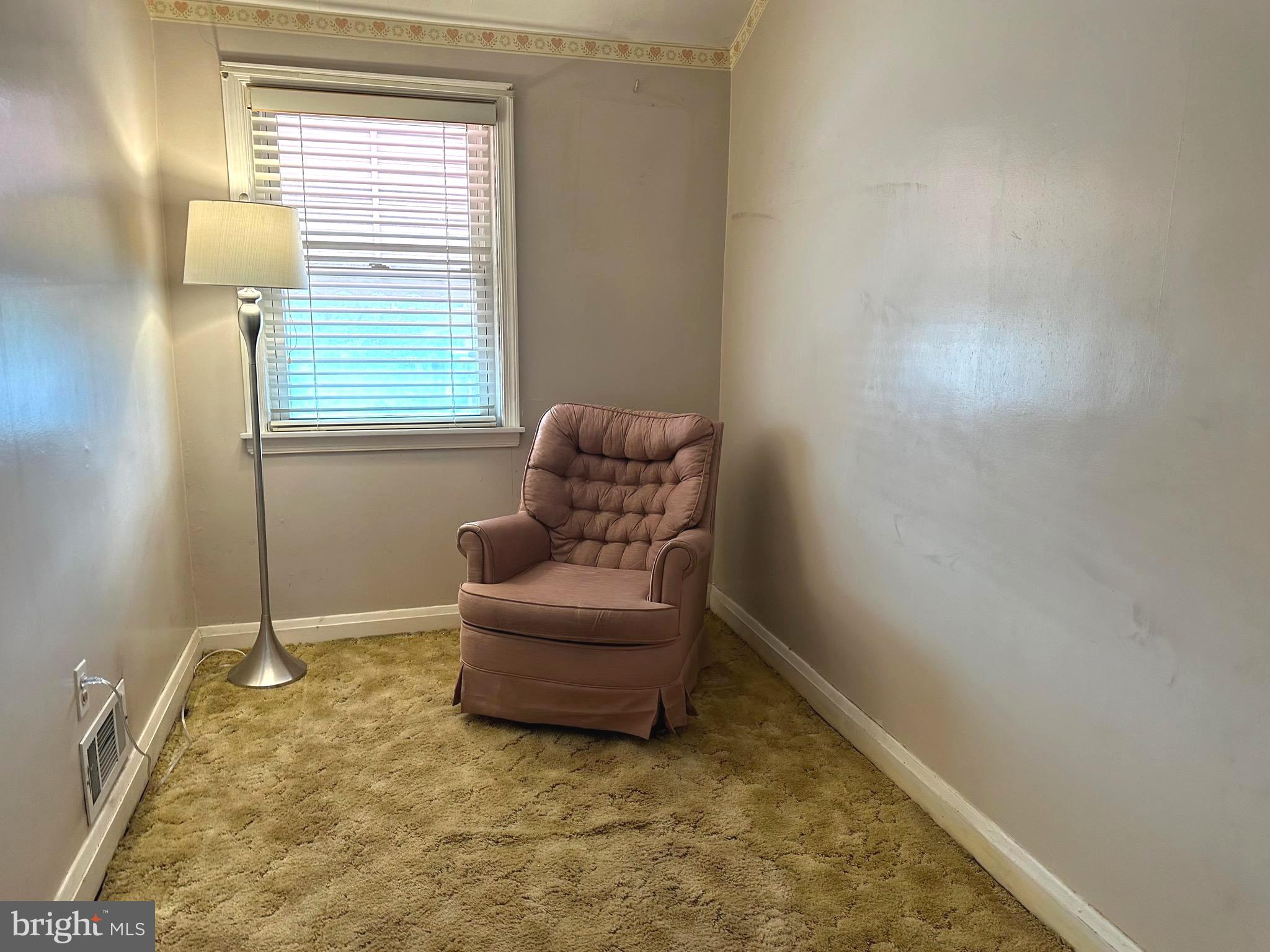 8454 Kavanagh Road Baltimore, MD 21222 - Photo 20 of 23 a living room with furniture and a window