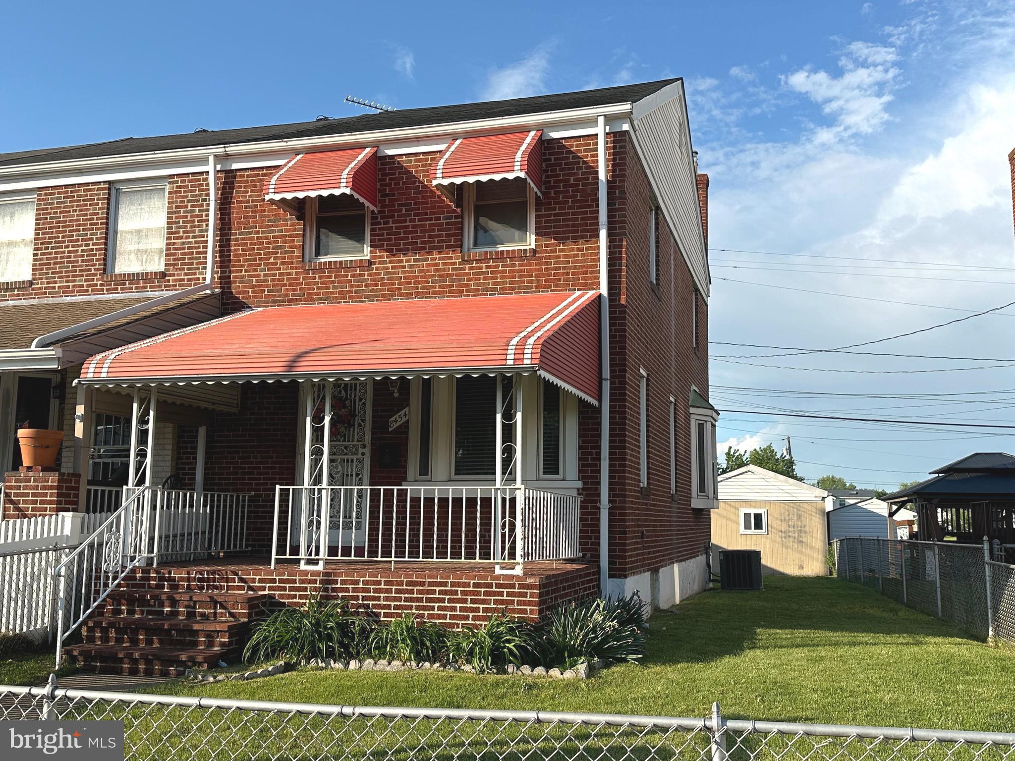 8454 Kavanagh Road Baltimore, MD 21222 - Photo 2 of 23 a view of a house with a small yard and wooden floor and fence