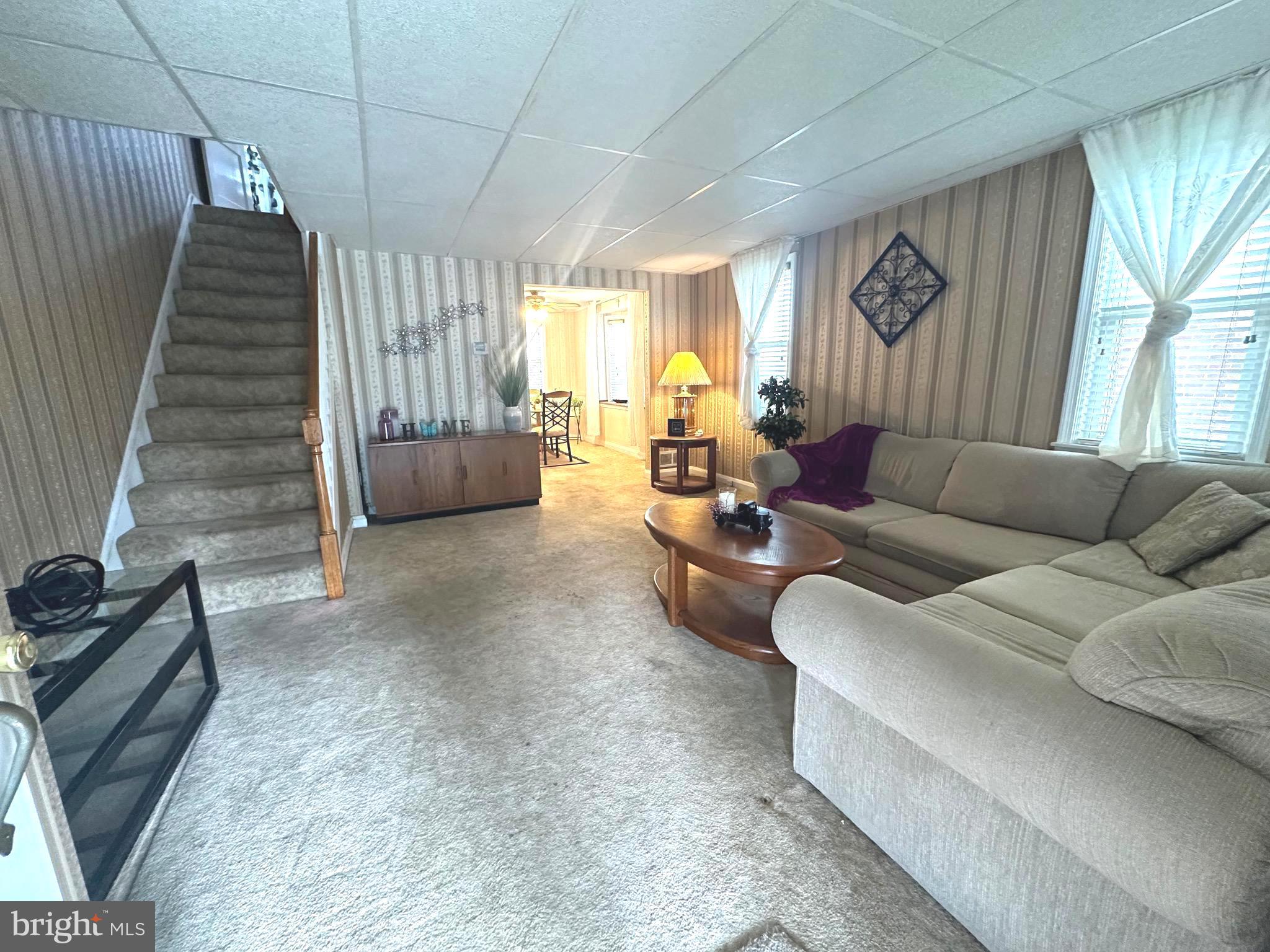 8454 Kavanagh Road Baltimore, MD 21222 - Photo 4 of 23 a living room with furniture and a large window