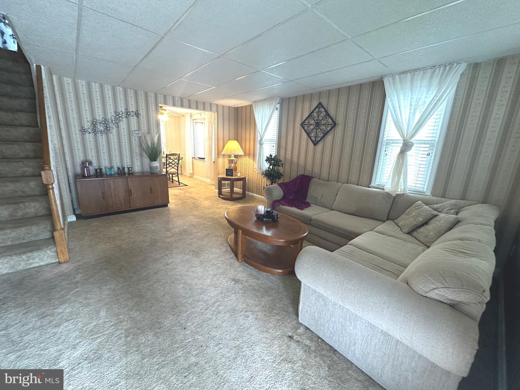 8454 Kavanagh Road Baltimore, MD 21222 - Photo 5 of 23 a living room with furniture and a large window