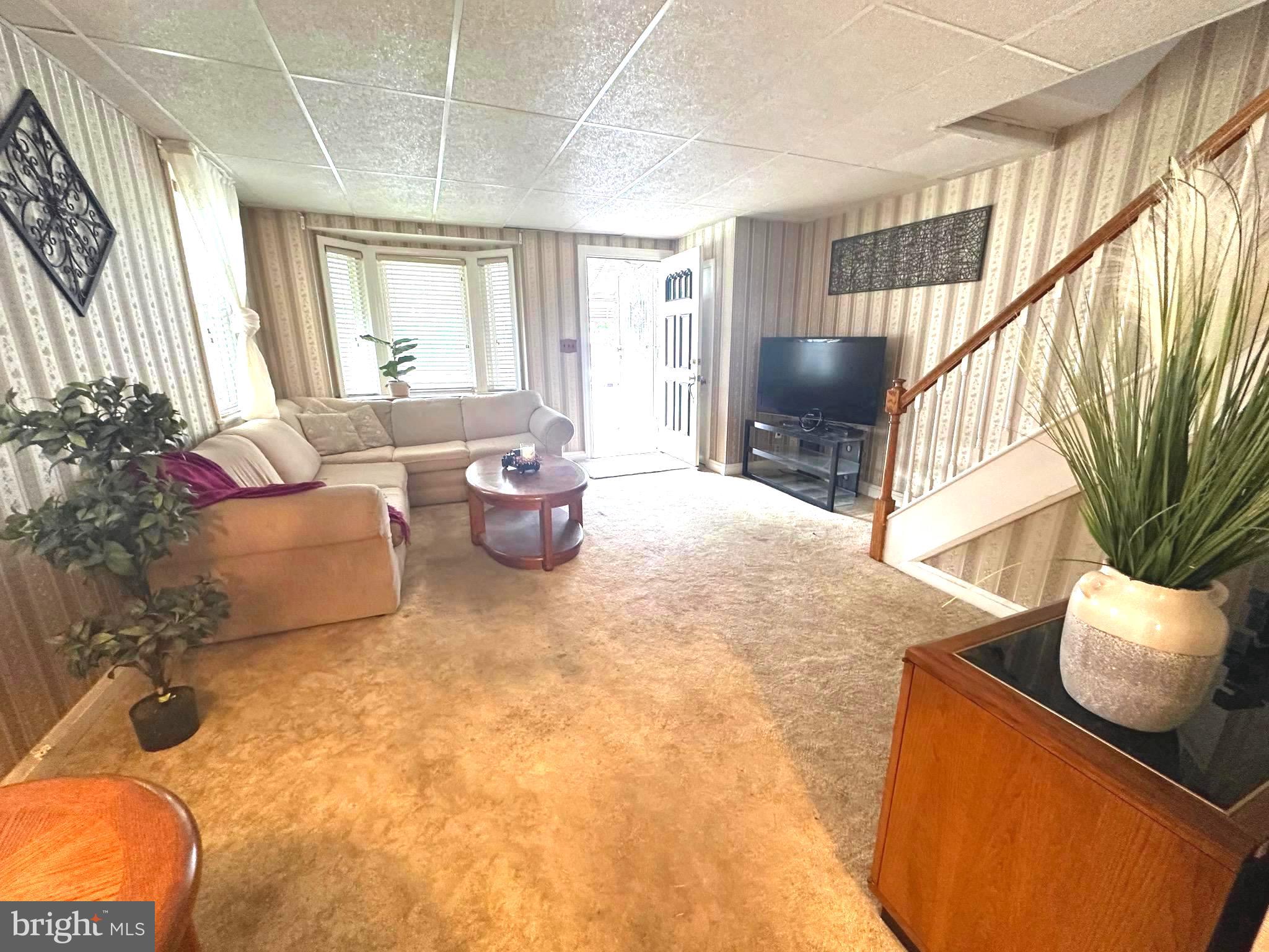 8454 Kavanagh Road Baltimore, MD 21222 - Photo 6 of 23 a living room with furniture and a large window