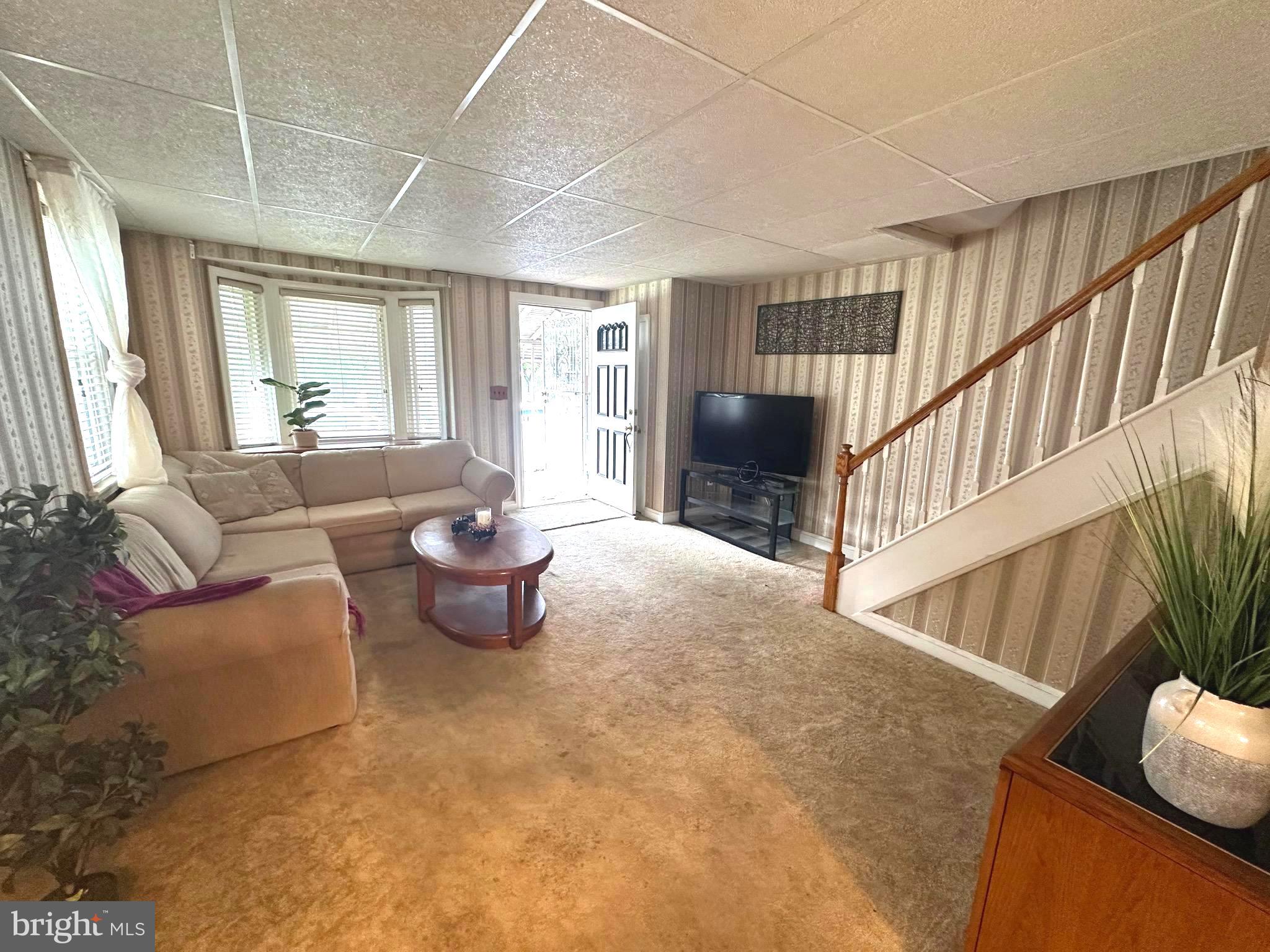8454 Kavanagh Road Baltimore, MD 21222 - Photo 7 of 23 a living room with furniture and a large window