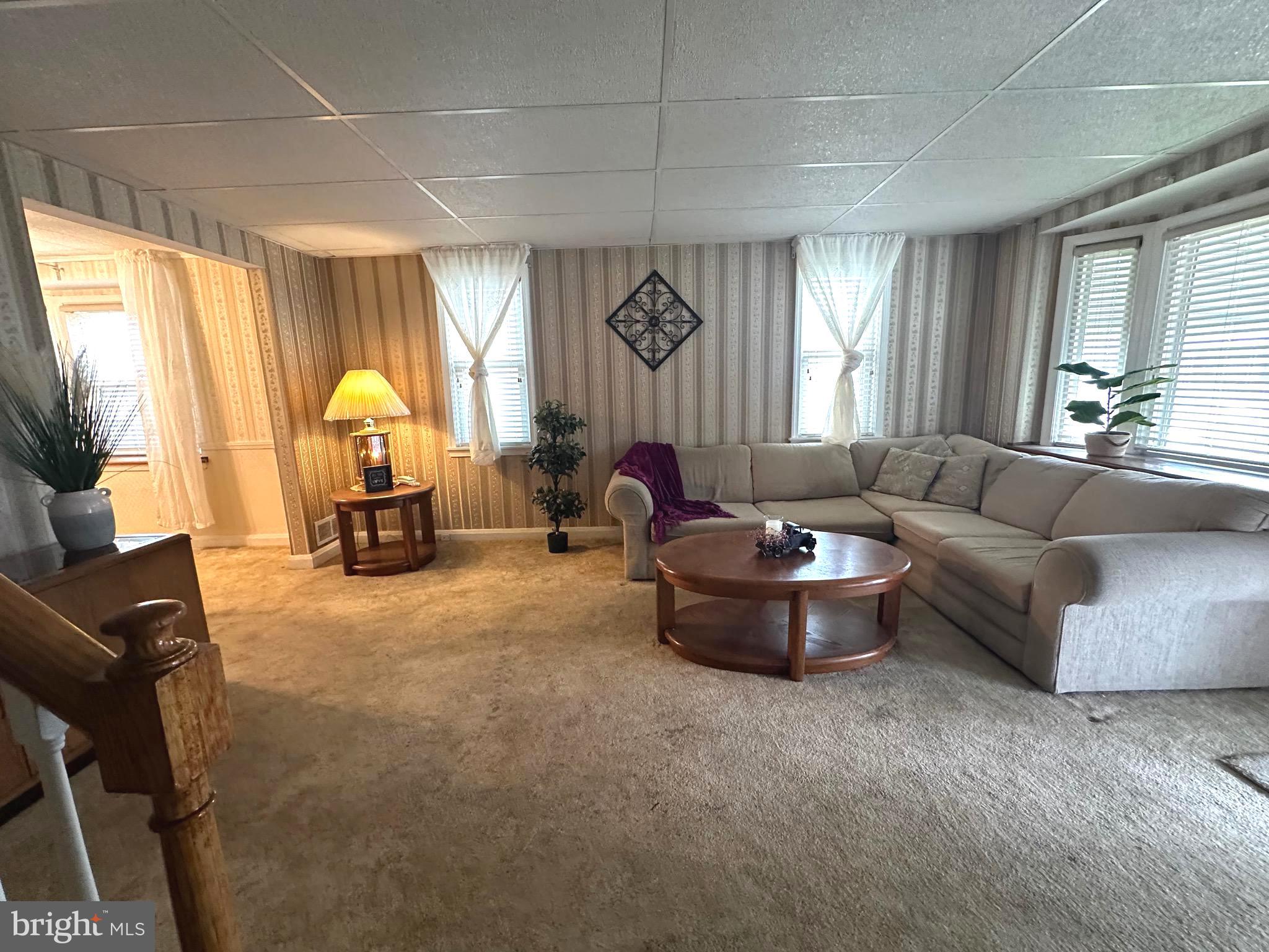 8454 Kavanagh Road Baltimore, MD 21222 - Photo 8 of 23 a living room with furniture and a large window