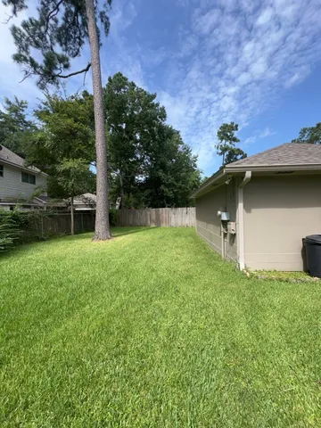 a backyard of a house with lots of green space