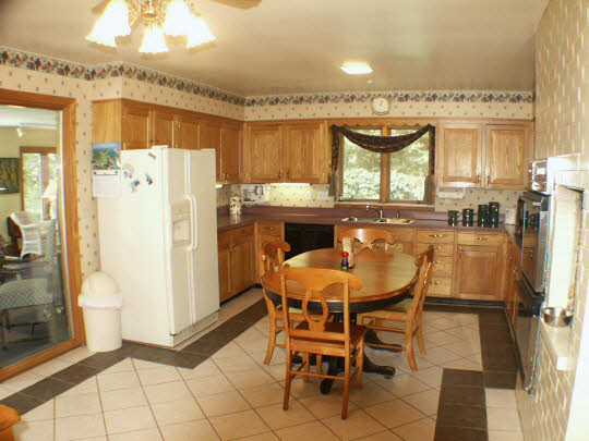 4007 Landstrom Road Rockford, IL 61107 - Photo 5 of 7 a dining table chair next to a window