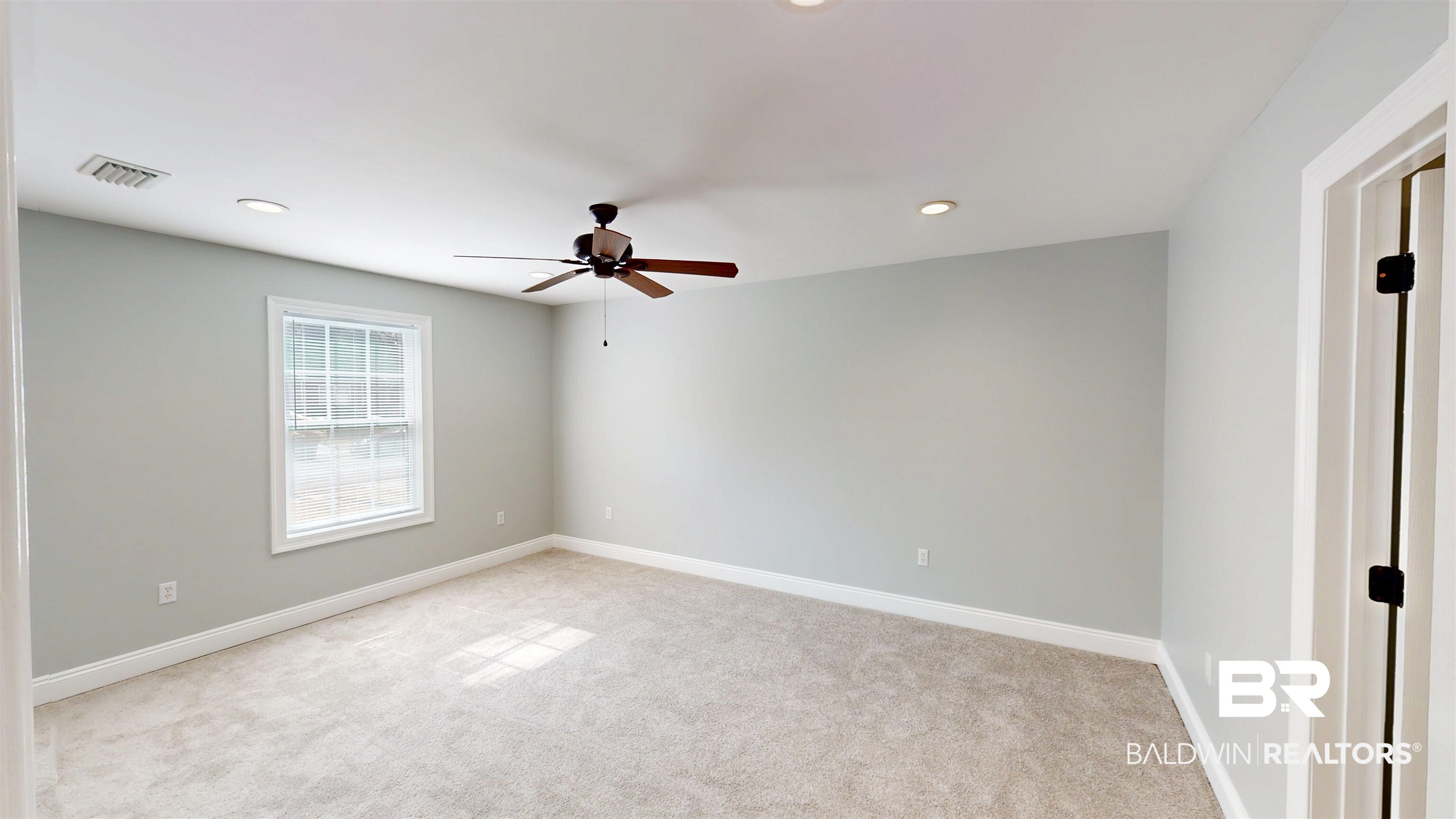 2454 Taylor Avenue Mobile, AL 36606 - Photo 13 of 24 Spare room with light colored carpet, recessed lighting, and a ceiling fan