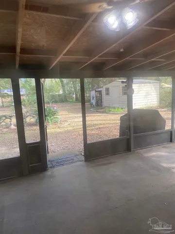 a front view of a house with yard patio and furniture