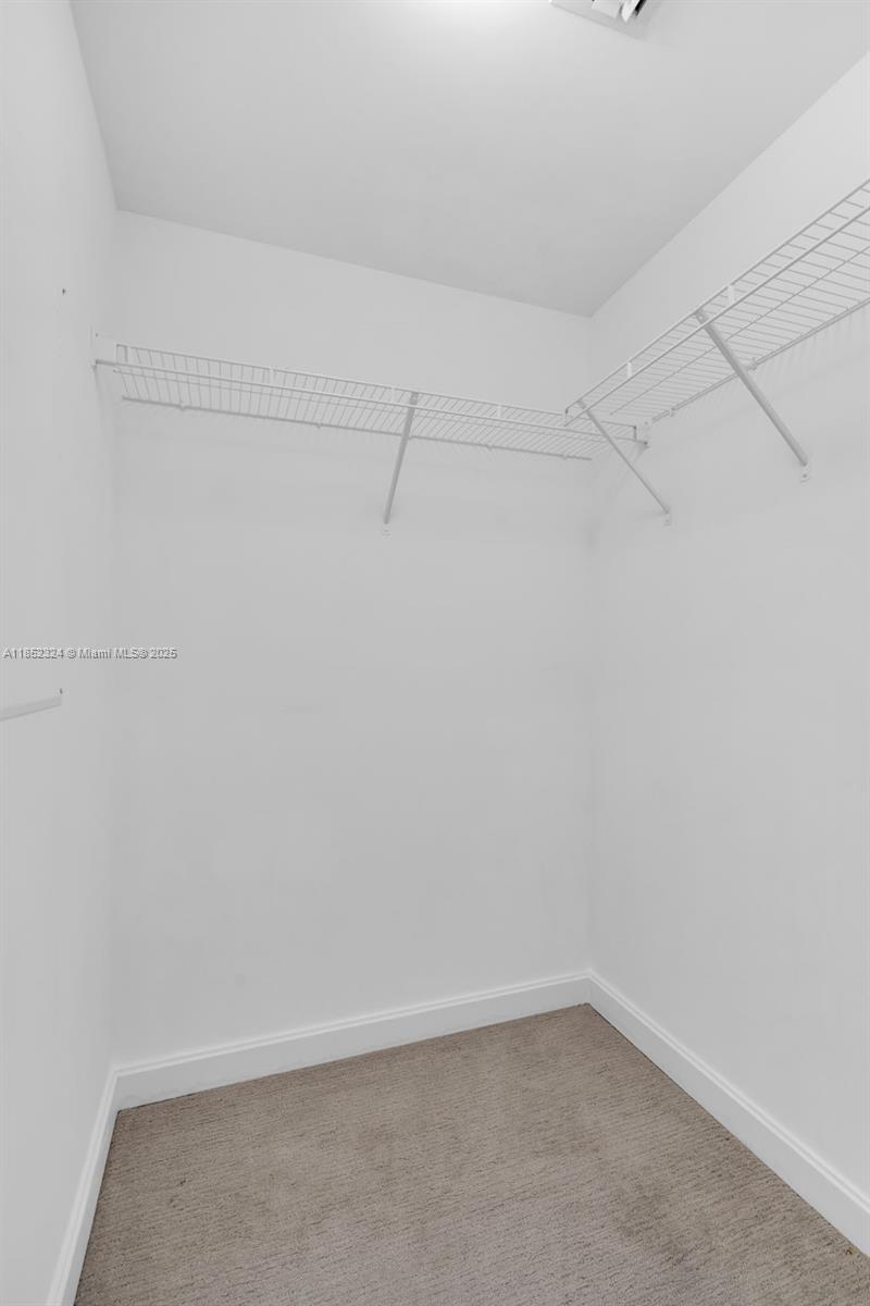 45 Southwest 9th Street, Unit 2204 Miami, FL 33130 - Photo 19 of 39 a view of a room with racks on the wall