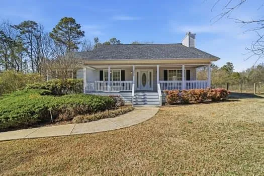 front view of a house with a yard