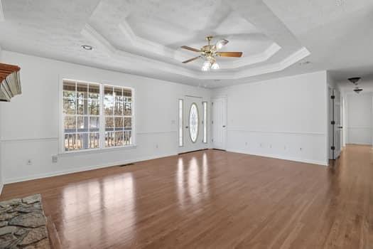 1828 4 Mile Church Road Ball Ground, GA 30107 - Photo 12 of 46 a view of an empty room with wooden floor and a window