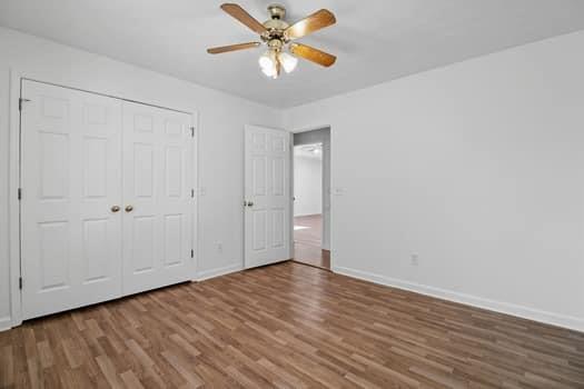 1828 4 Mile Church Road Ball Ground, GA 30107 - Photo 13 of 46 a view of an empty room with window and a ceiling fan