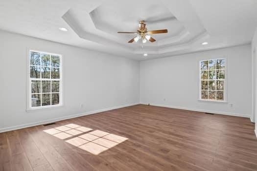 1828 4 Mile Church Road Ball Ground, GA 30107 - Photo 14 of 46 a view of an empty room with wooden floor and a window