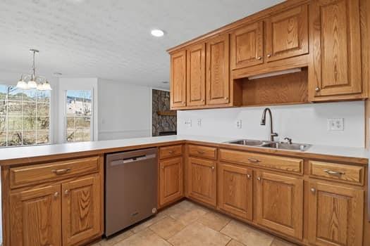 1828 4 Mile Church Road Ball Ground, GA 30107 - Photo 18 of 46 a kitchen with sink and cabinets